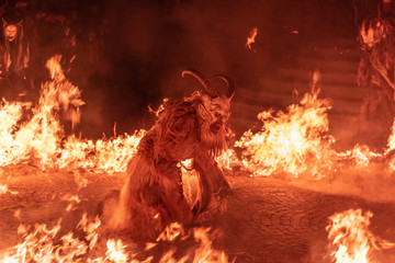 Fire red. In the flames. Krampus, Christmas devils