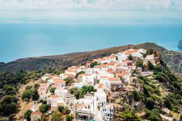 Fototapeta premium Traditional Greek village with white houses, Nikia, Nisyros, Greece