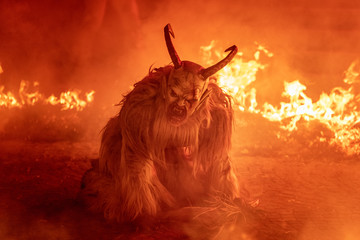 Fire red. In the flames. Krampus, Christmas devils - 239638837