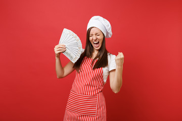 Housewife female chef cook baker in striped apron white t-shirt toque chefs hat isolated on red...