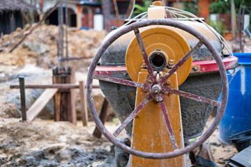 Mobile cement or concrete mixer at construction site.