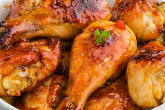 Baked Glazed Chicken Drumsticks. Marinated In Teriyaki, Apricot Jam, Wine Vinegar And Corn Starch Sauce. Close-up