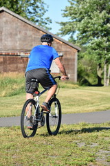 Fototapeta premium Exercising Athlete Retiree Male Cyclist Exercising