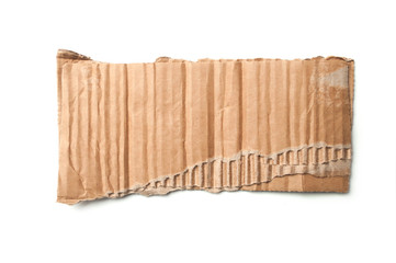 closeup of torn cardboard piece on white background