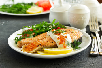 grilled salmon steak with cream sauce.
