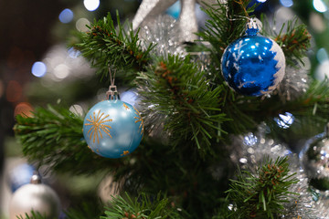 Close-up Christmas decorations. blue and silver balls and stars.