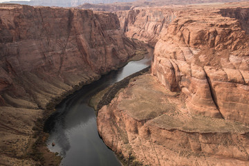 A distant look at the horseshoe bend of river in Antelope Canyon. It is a bright sunny day and the river looks beautiful from distance.