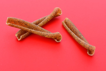 casarecce of legume on red background