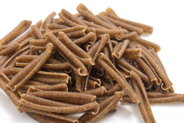 casarecce of legume pasta on white background