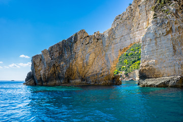 Fototapeta premium Greece, Zakynthos, Turquoise paradise like ocean water under arch of rock near keri