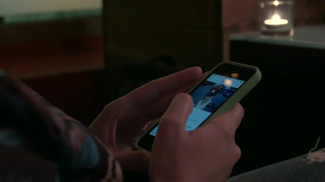 HD a peson looks through twitter profile