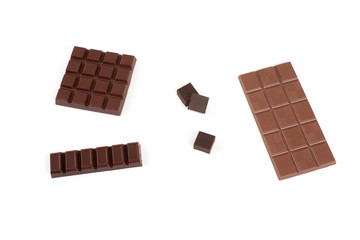 Set with different kinds of chocolate on white background.