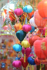 Fototapeta na wymiar Paper lanterns in a traditional street in Vietnam with copy space for text or advertising or background