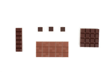 Set with different kinds of chocolate on white background.