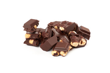 Chocolate pieces with nuts isolated on white background