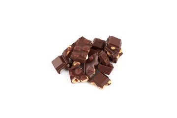 Chocolate pieces with nuts isolated on white background