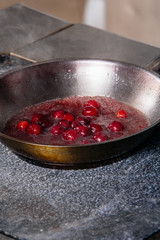 cherry sauce for poultry in a pan