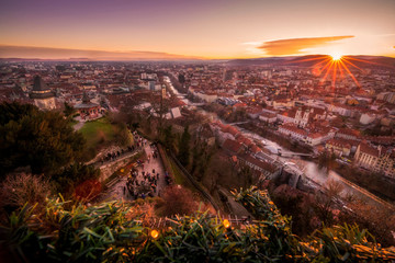 Beautiful winter sunset landscape mountains town on Christmas Xmas advent in city Graz, Austria, Europe.