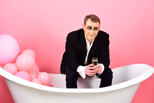 Drinking sparkling wine for festive occasions. Mime actor has celebration party. Mime man celebrate party in bath. Comedian actor enjoy theatre party celebrating. Think celebration, think champagne