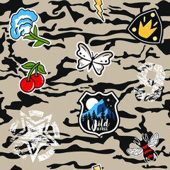 Army seamless pattern. Repeating camouflage print with cool patches. Hand drawn camo fashion background with retro and military badges. Vector illustration