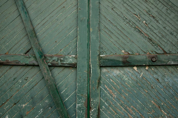 Isolated view of old weathered wooden green doors