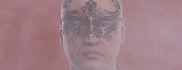 portrait of a man in a venetian masquerade mask