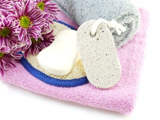 soap bar on white bath towel and scrub on white background