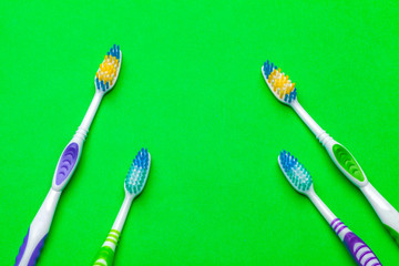 toothbrush on green background, dental care concept