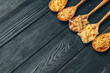 Various pasta on spoons