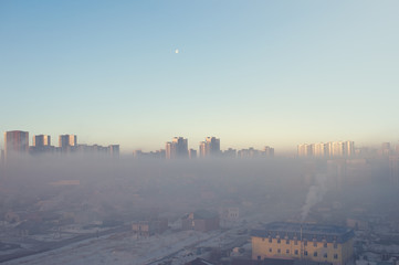 Aerial view of Astana city with skyscrapers and old town. Astana town in the plane window
