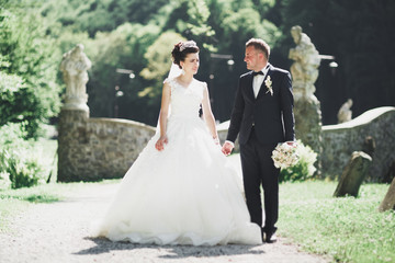 Caucasian happy romantic young couple celebrating their marriage. Outdoor