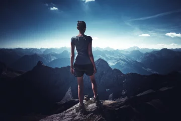 Foto op Plexiglas Young sportive woman on top of mountain © XtravaganT