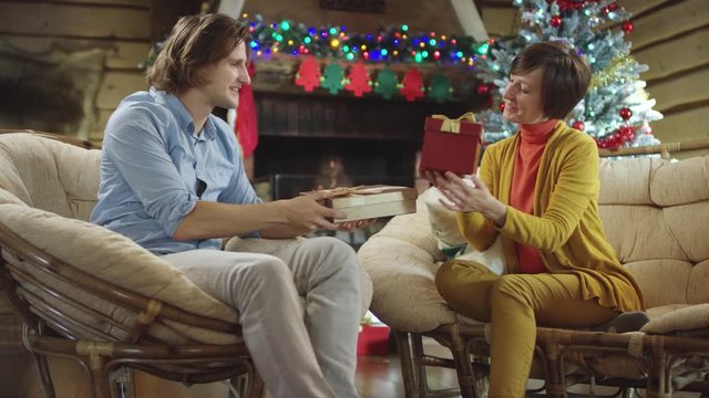 Mother and son exchanging gifts on Christmas