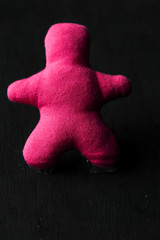 pink stick man on a black background