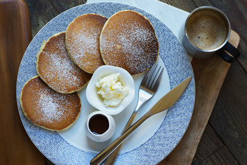 original pancakes with fork and knife and coffee