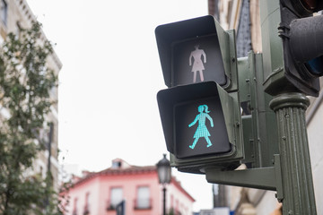 Image of a traffic signal is seen on this closeup. On the background, buildings and the cityscape...