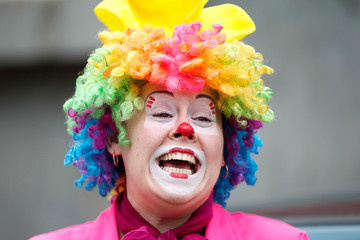 A woman clown laughs gaily.Joyful children's clown
