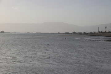 Shore, see, boats and mountains