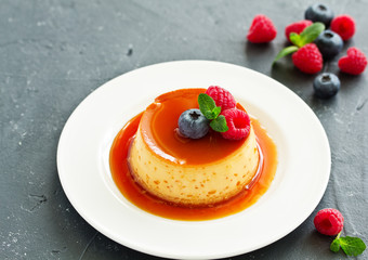 delicious dessert creme brulee with berries.