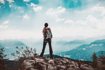 Fototapeta premium Woman hiker observing the view from the mountain