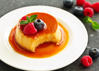 delicious dessert creme brulee with berries.