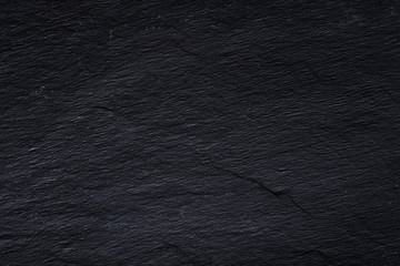 Dark gray black slate background or texture of natural stone. © kseniaso