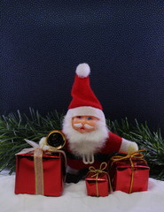 Cute kiddie's Christmas card with Santa bearing gifts in the snow.