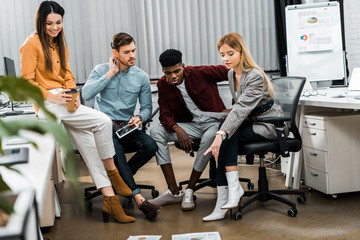 Fototapeta premium multicultural young businesspeople discussing new business idea in office