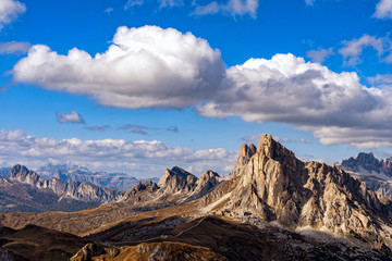 Fototapeta na wymiar Scenic view of majestic Dolomites mountains in Italian Alps. Landscape shot at the Passo di Giau, in the the Italian Dolomites, during autumn time.
