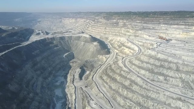 asbestos mining dumps in pit canyon against white terraces