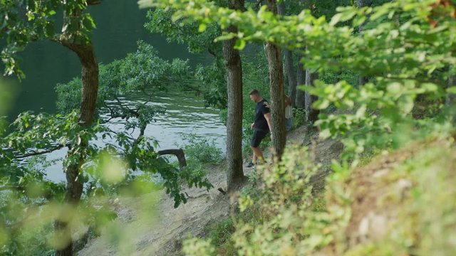 Couple walking by a river