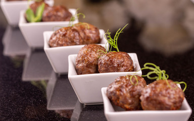 Quenelles meat with greens