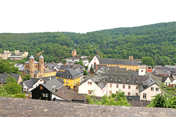 The city is small among the mountains with a vineyard