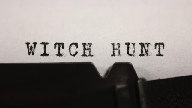 Accusations, persecution and harassment. WITCH HUNT typed on an old mechanical typewriter.
